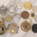 Lot 164 - Grouping Of 14 Vintage Metal Objects And Medallions Including Dance, Religious, And Commemorative Pieces