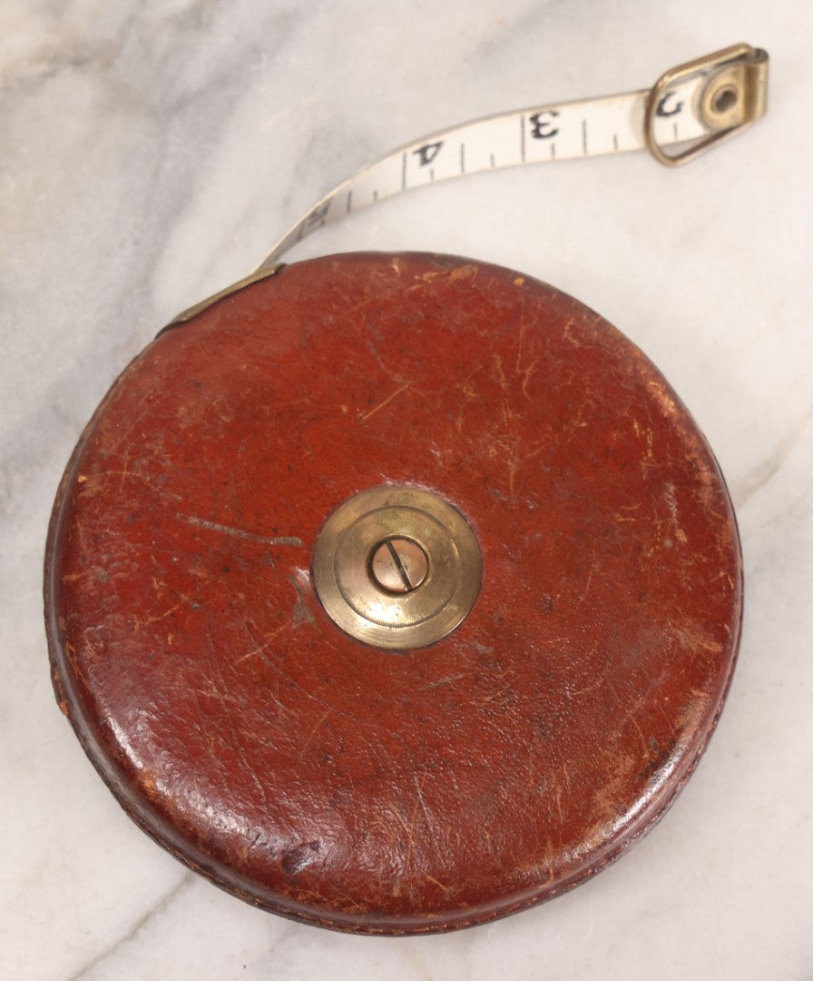 Lot 165 - Grouping Of Four Antique And Vintage Tools Including John Rabone & Sons 50 Ft Tape Measure, 5-1/4" Diameter, And Three Pottery Tools, 7-1/2" L Each