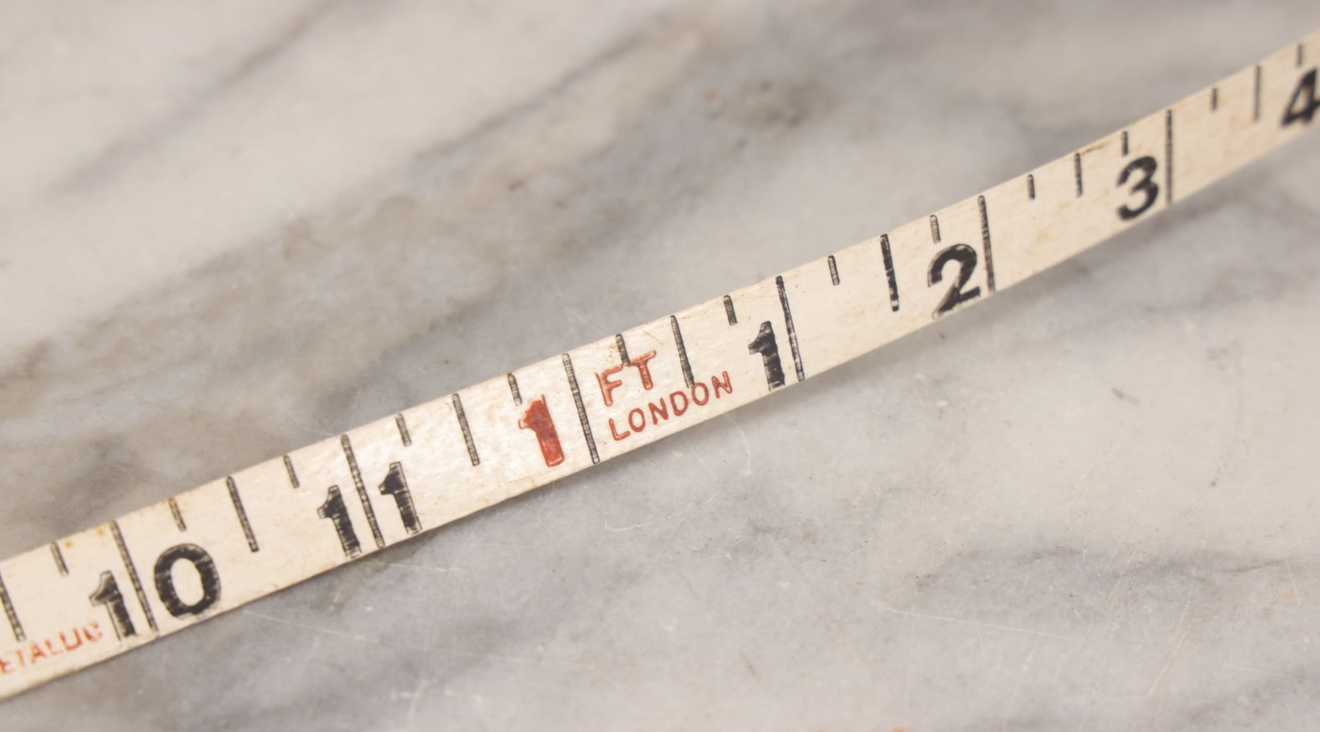 Lot 165 - Grouping Of Four Antique And Vintage Tools Including John Rabone & Sons 50 Ft Tape Measure, 5-1/4" Diameter, And Three Pottery Tools, 7-1/2" L Each