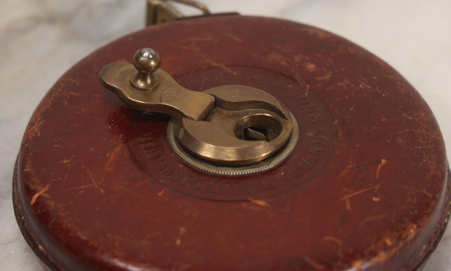 Lot 165 - Grouping Of Four Antique And Vintage Tools Including John Rabone & Sons 50 Ft Tape Measure, 5-1/4" Diameter, And Three Pottery Tools, 7-1/2" L Each