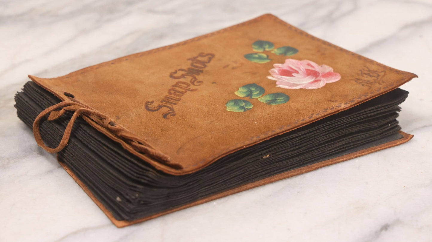 Lot 168 - Antique Snapshot Photograph Album, Leather Covers With Hand-Painted Pink Flower, Including Photos Of People With Bikes, Soldiers In Uniform, Babies, Children, Dolls, Pets, Circa 1900s-1910s