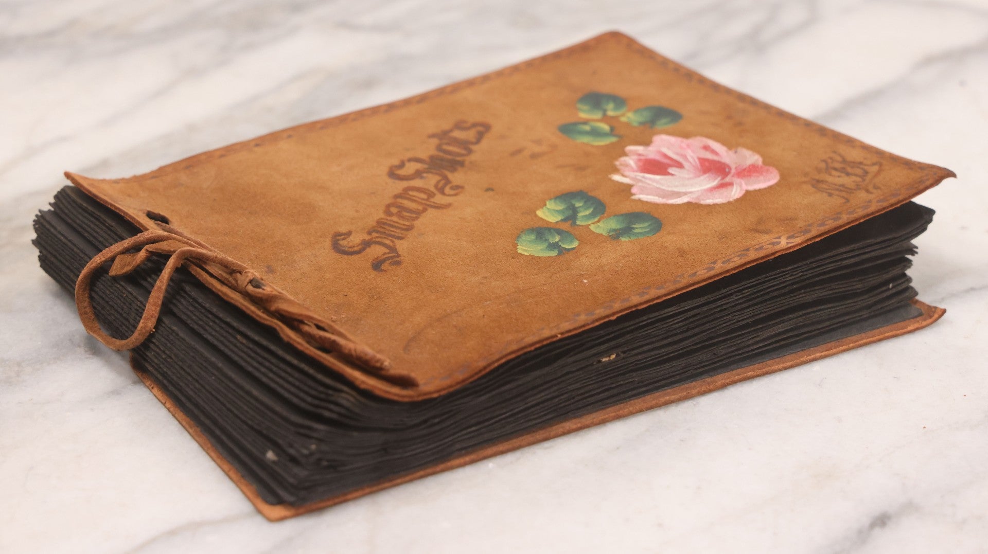 Lot 168 - Antique Snapshot Photograph Album, Leather Covers With Hand-Painted Pink Flower, Including Photos Of People With Bikes, Soldiers In Uniform, Babies, Children, Dolls, Pets, Circa 1900s-1910s