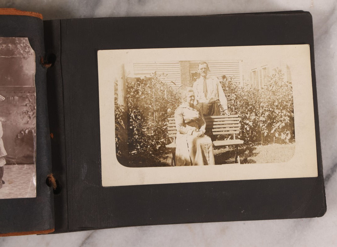 Lot 168 - Antique Snapshot Photograph Album, Leather Covers With Hand-Painted Pink Flower, Including Photos Of People With Bikes, Soldiers In Uniform, Babies, Children, Dolls, Pets, Circa 1900s-1910s