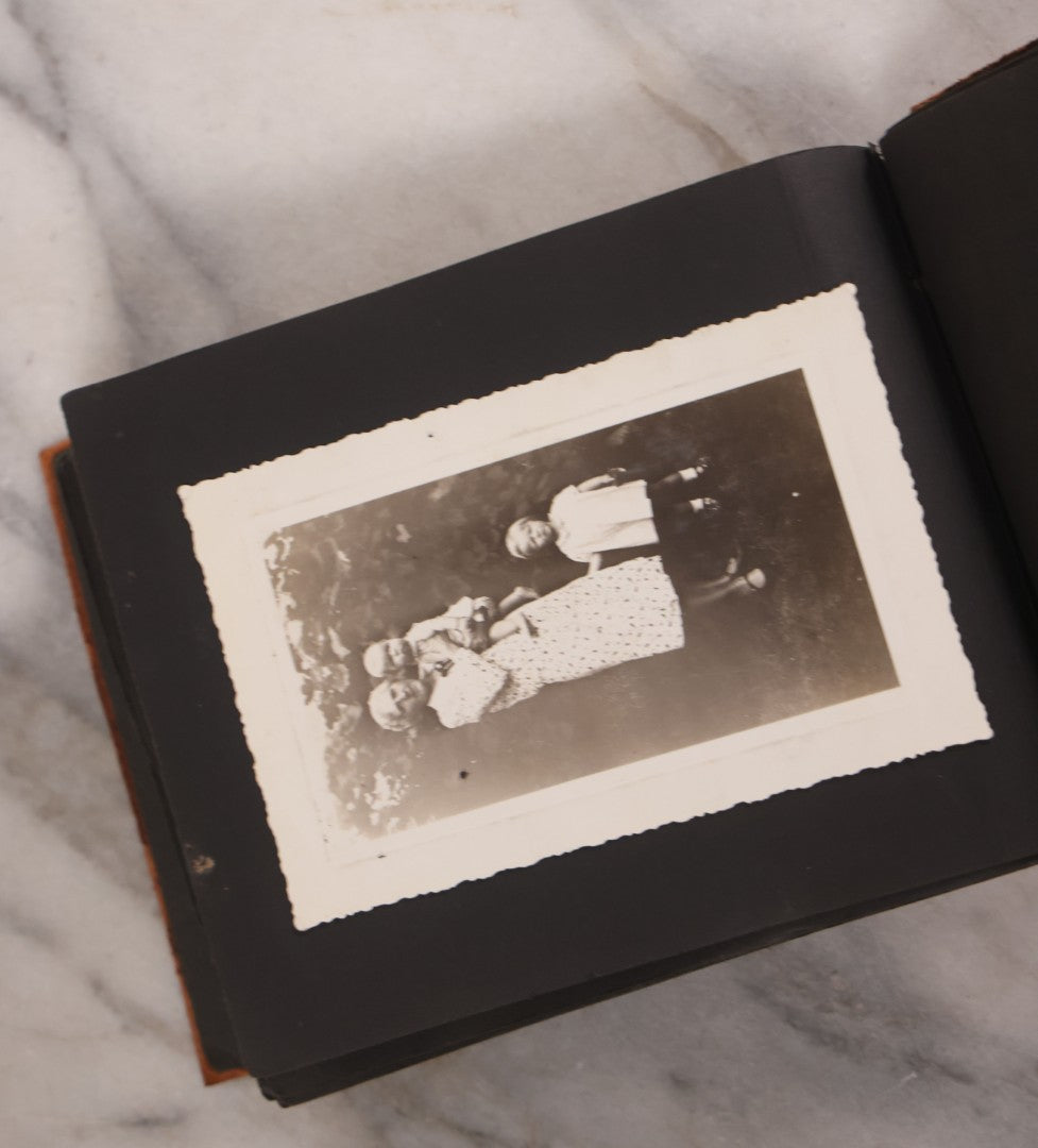 Lot 168 - Antique Snapshot Photograph Album, Leather Covers With Hand-Painted Pink Flower, Including Photos Of People With Bikes, Soldiers In Uniform, Babies, Children, Dolls, Pets, Circa 1900s-1910s