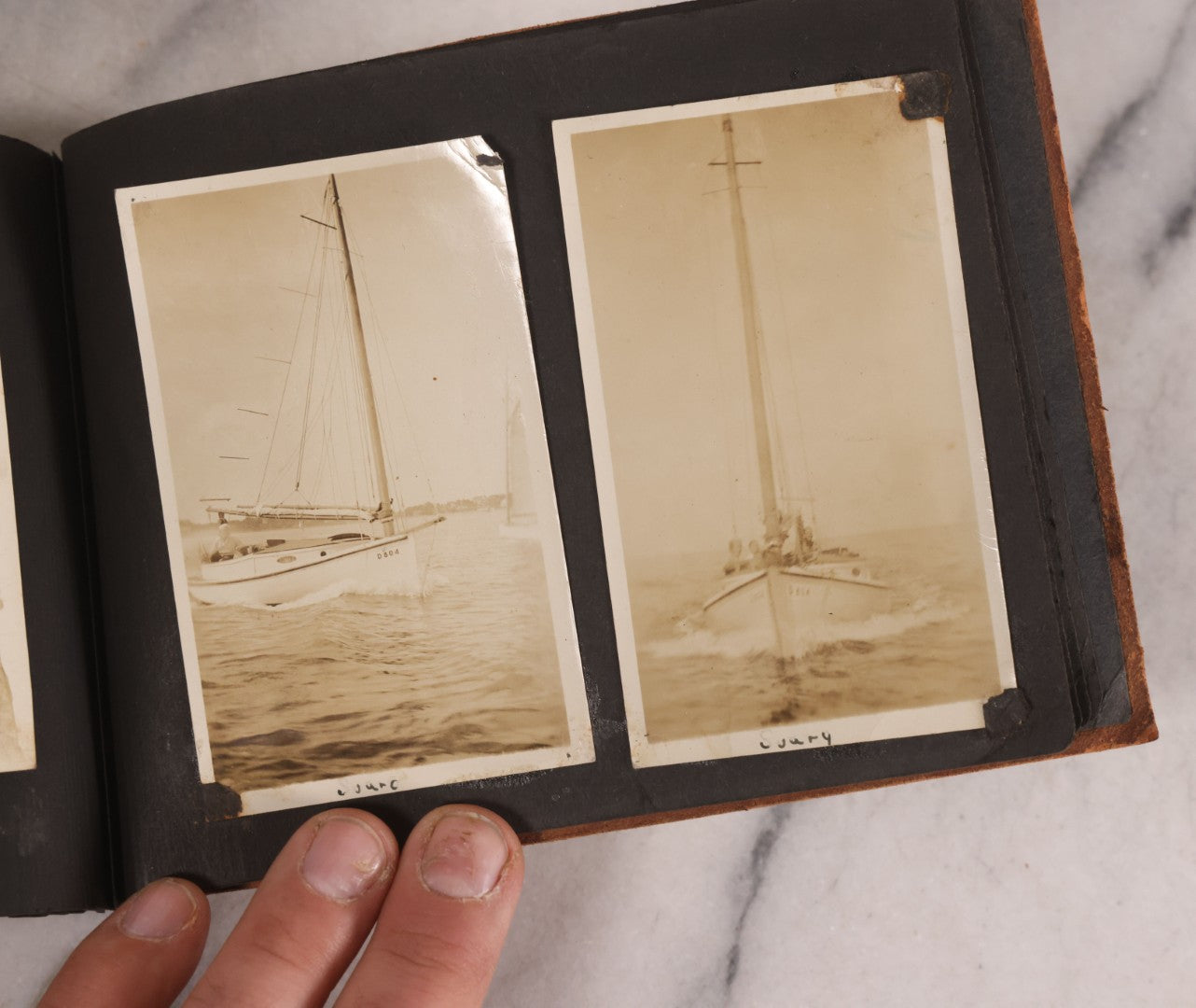 Lot 168 - Antique Snapshot Photograph Album, Leather Covers With Hand-Painted Pink Flower, Including Photos Of People With Bikes, Soldiers In Uniform, Babies, Children, Dolls, Pets, Circa 1900s-1910s