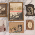 Lot 170 - Grouping Of 10 Antique Photographs In Miscellaneous Frames Including Damaged Thermoplastic Frame, Illustrated Frame With Brownies Characters, Folding Glass Mounted Photo Frame With Pastor And Church, Velvet Frame With C.D.V. Of Child, Tintypes
