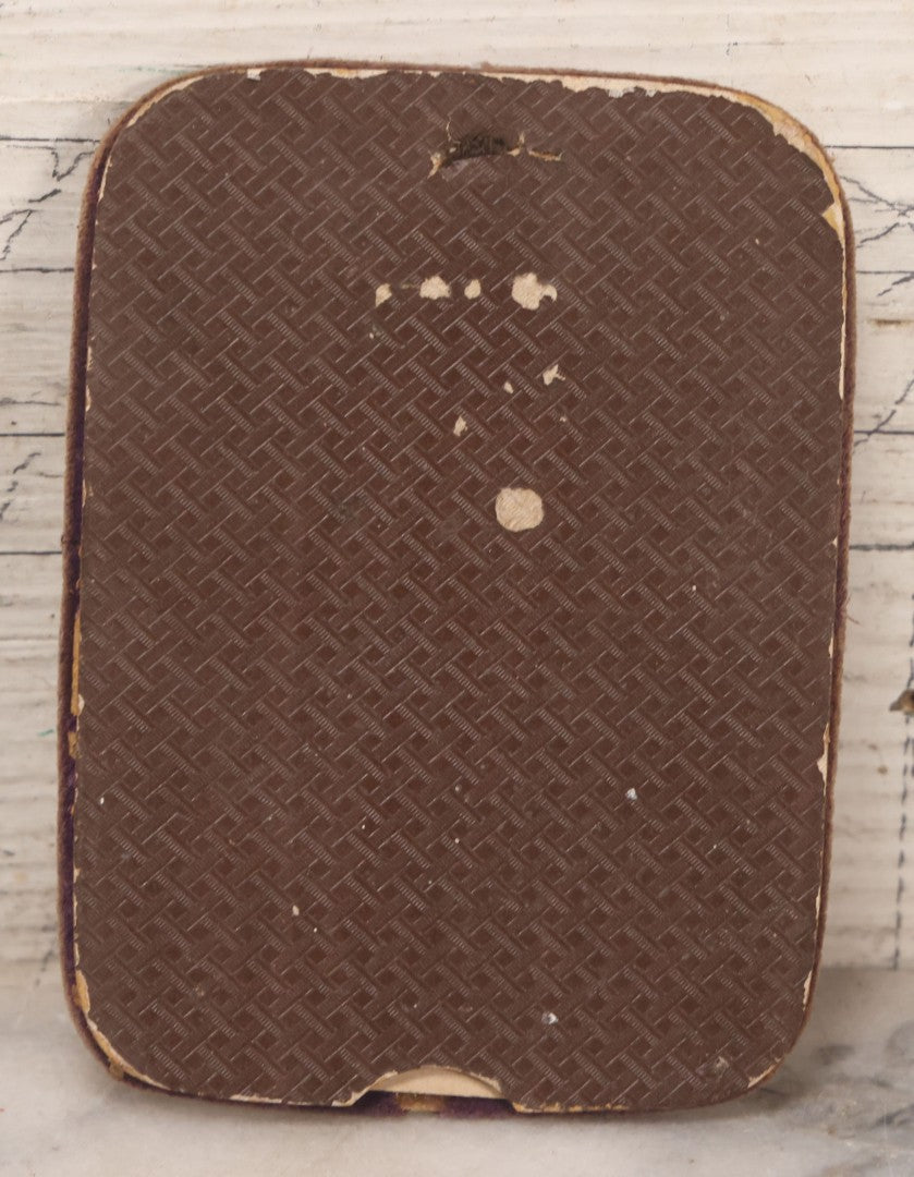 Lot 170 - Grouping Of 10 Antique Photographs In Miscellaneous Frames Including Damaged Thermoplastic Frame, Illustrated Frame With Brownies Characters, Folding Glass Mounted Photo Frame With Pastor And Church, Velvet Frame With C.D.V. Of Child, Tintypes