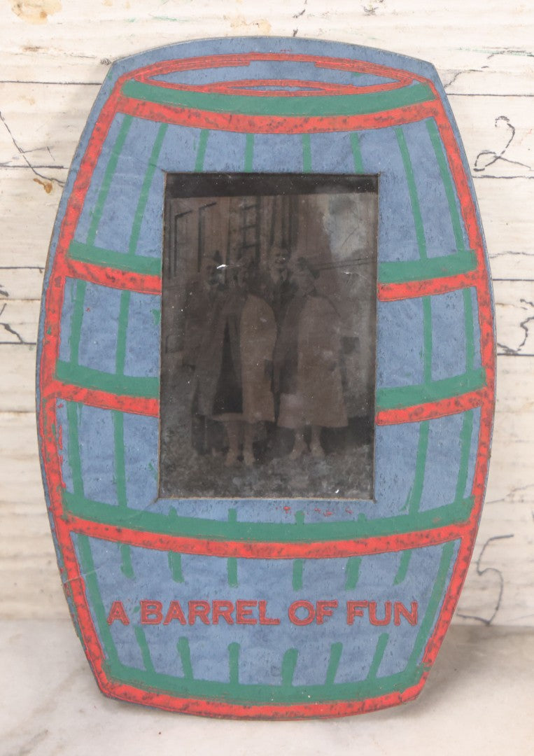 Lot 170 - Grouping Of 10 Antique Photographs In Miscellaneous Frames Including Damaged Thermoplastic Frame, Illustrated Frame With Brownies Characters, Folding Glass Mounted Photo Frame With Pastor And Church, Velvet Frame With C.D.V. Of Child, Tintypes