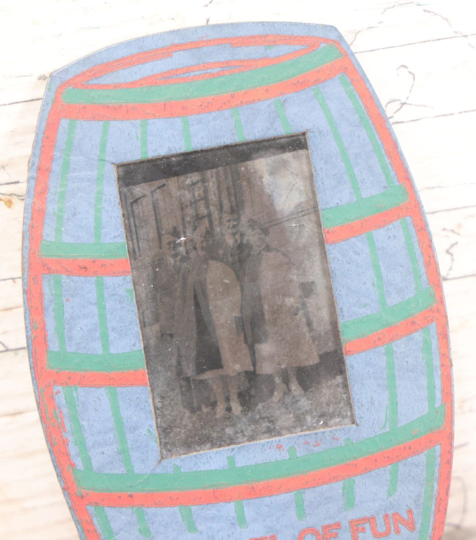 Lot 170 - Grouping Of 10 Antique Photographs In Miscellaneous Frames Including Damaged Thermoplastic Frame, Illustrated Frame With Brownies Characters, Folding Glass Mounted Photo Frame With Pastor And Church, Velvet Frame With C.D.V. Of Child, Tintypes