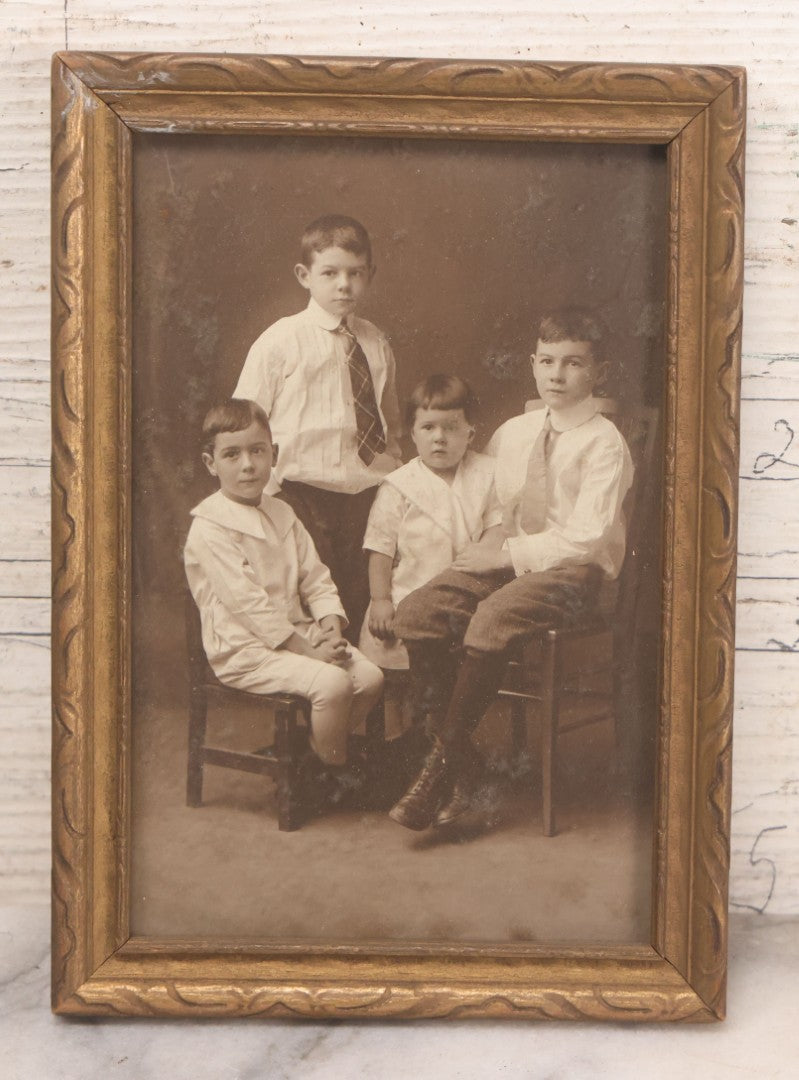 Lot 170 - Grouping Of 10 Antique Photographs In Miscellaneous Frames Including Damaged Thermoplastic Frame, Illustrated Frame With Brownies Characters, Folding Glass Mounted Photo Frame With Pastor And Church, Velvet Frame With C.D.V. Of Child, Tintypes