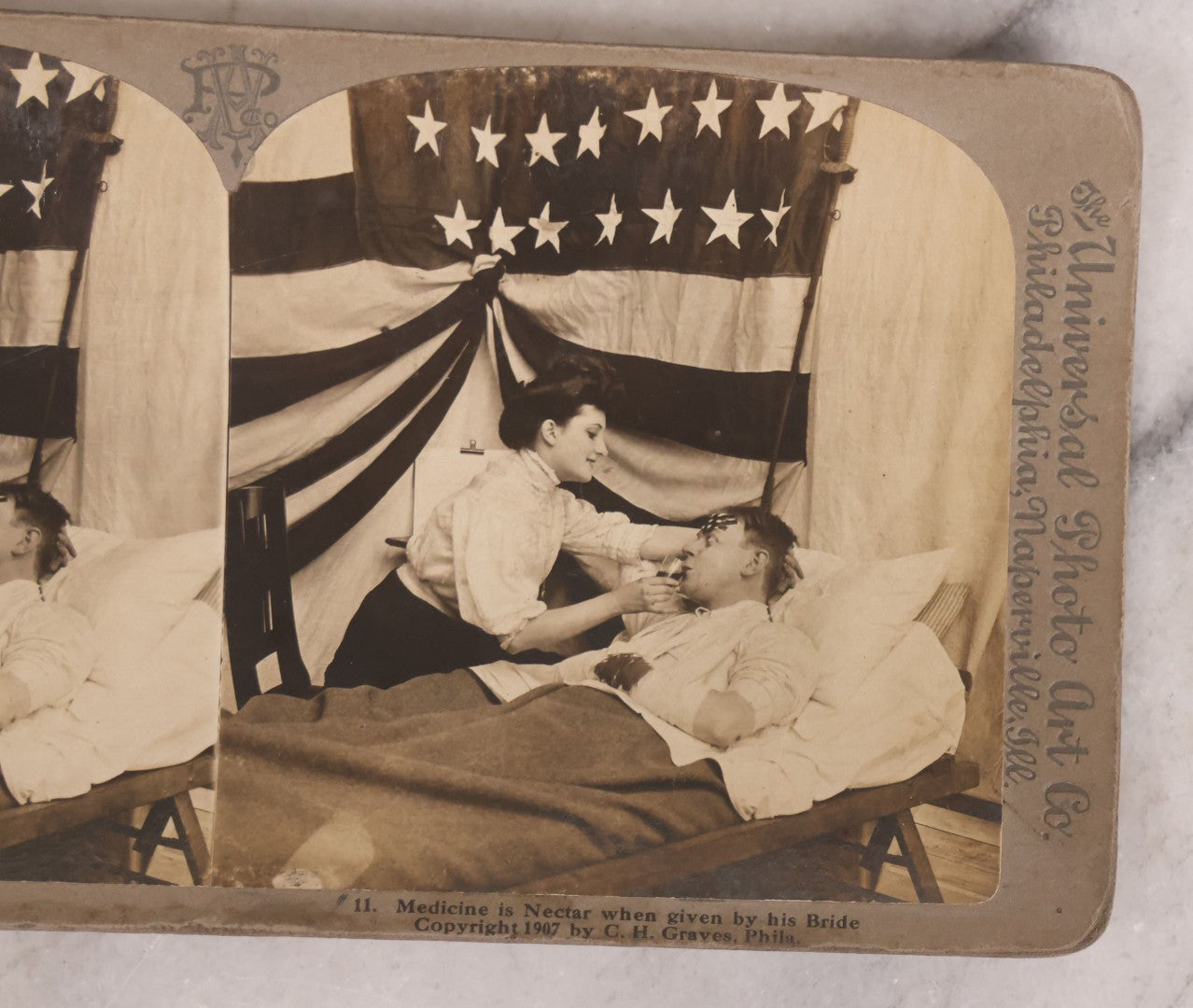 Lot 173 - Grouping Of Five Antique Stereo View Cards, Romantic Scenes Of Wounded Soldier In Bed Before American Flag, Art Nouveau (Platino) Stereograph Cards Published By Universal Photo Art Co., Copyright C.H. Graves, Publisher, 1907, Philadelphia