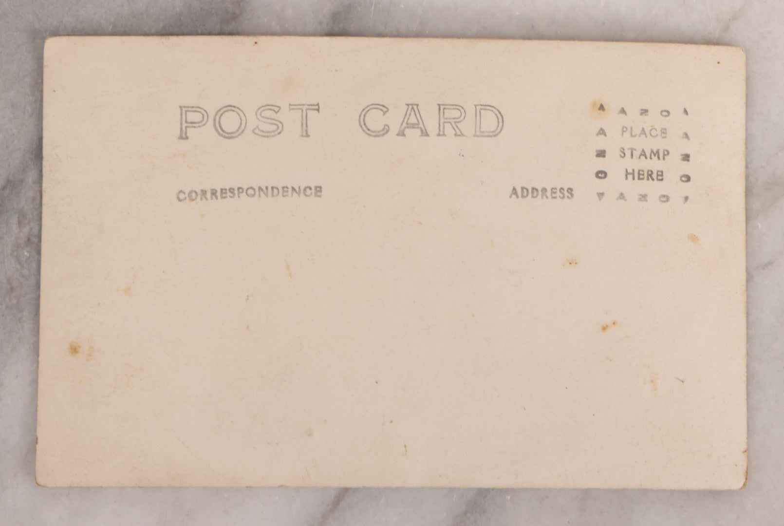 Lot 174 - Antique Real Photo Postcard R.P.P.C. Of Man In Uniform And Cap With Cigarette Before American Flag Backdrop, Circa 1910s