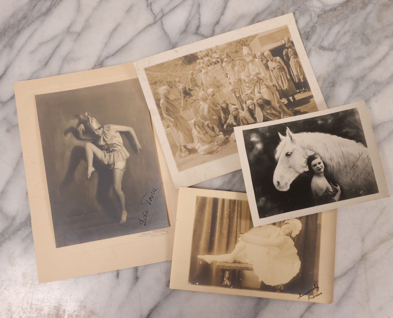 Lot 180 - Grouping Of Four Unmounted Antique Photographs Of Performers Including Biblical Play Scene, Two Dancers, And Performer With Horse