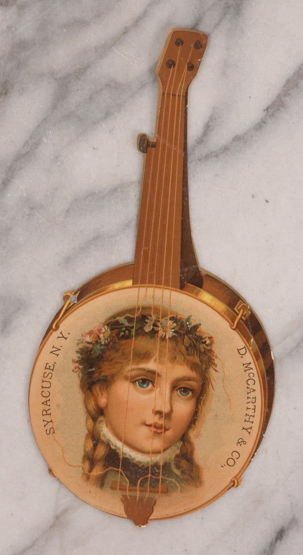 Lot 189 - Grouping Of Four Large Size Antique Chromolithograph Die Cut Advertisements Including Hood's Sarsaparilla, 1889, D. McCarthy & Co., Syracuse, New York In Banjo Form, And Two 1880s The Great Atlantic And Pacific Tea Co.