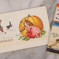 Lot 191 - Pair Of Halloween Ephemera Items Including Antique Halloween Postcard Postmarked 1913 And Vintage Matchbook Cover With Witch Pinup Woman Advertising Lampley's Grill & Service Center, Nashville And Goodlettsville, Tennessee