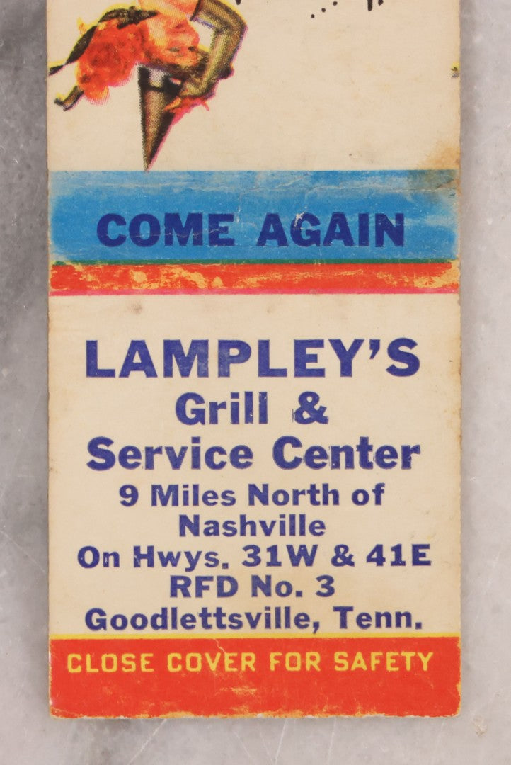 Lot 191 - Pair Of Halloween Ephemera Items Including Antique Halloween Postcard Postmarked 1913 And Vintage Matchbook Cover With Witch Pinup Woman Advertising Lampley's Grill & Service Center, Nashville And Goodlettsville, Tennessee