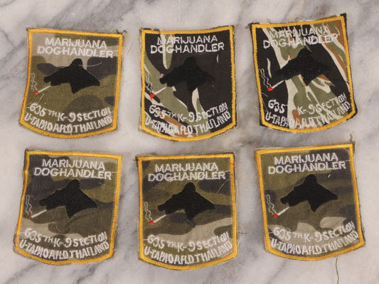 Lot 205 - Grouping Of Six Vintage Vietnam Era Marijuana Doghandler United States Air Force 635th K-9 Section, Thailand Embroidered Patches With Silhouette Of Dog Smoking Joint