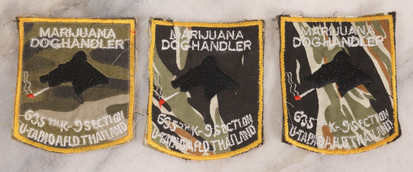 Lot 205 - Grouping Of Six Vintage Vietnam Era Marijuana Doghandler United States Air Force 635th K-9 Section, Thailand Embroidered Patches With Silhouette Of Dog Smoking Joint