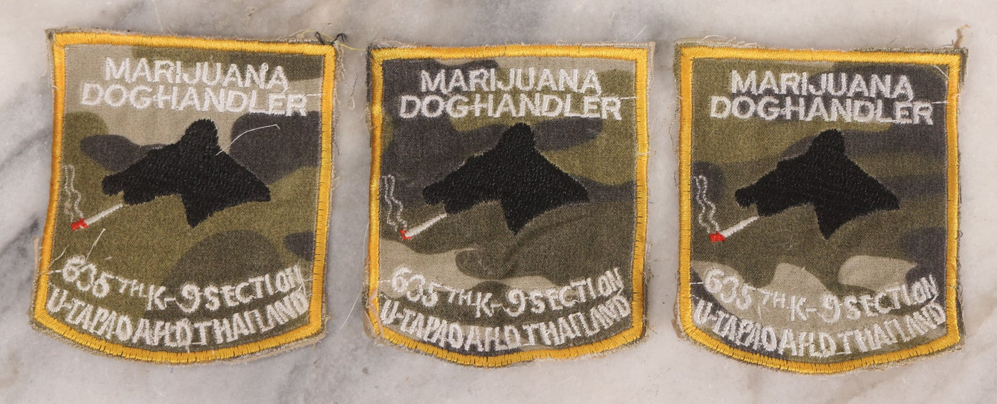Lot 205 - Grouping Of Six Vintage Vietnam Era Marijuana Doghandler United States Air Force 635th K-9 Section, Thailand Embroidered Patches With Silhouette Of Dog Smoking Joint