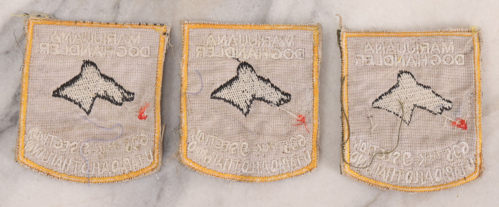 Lot 205 - Grouping Of Six Vintage Vietnam Era Marijuana Doghandler United States Air Force 635th K-9 Section, Thailand Embroidered Patches With Silhouette Of Dog Smoking Joint