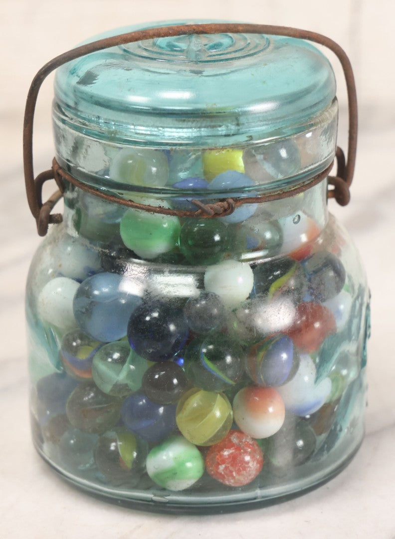 Lot 211 - Vintage Mason Jar Full Of Marbles With Wire Bail Closure