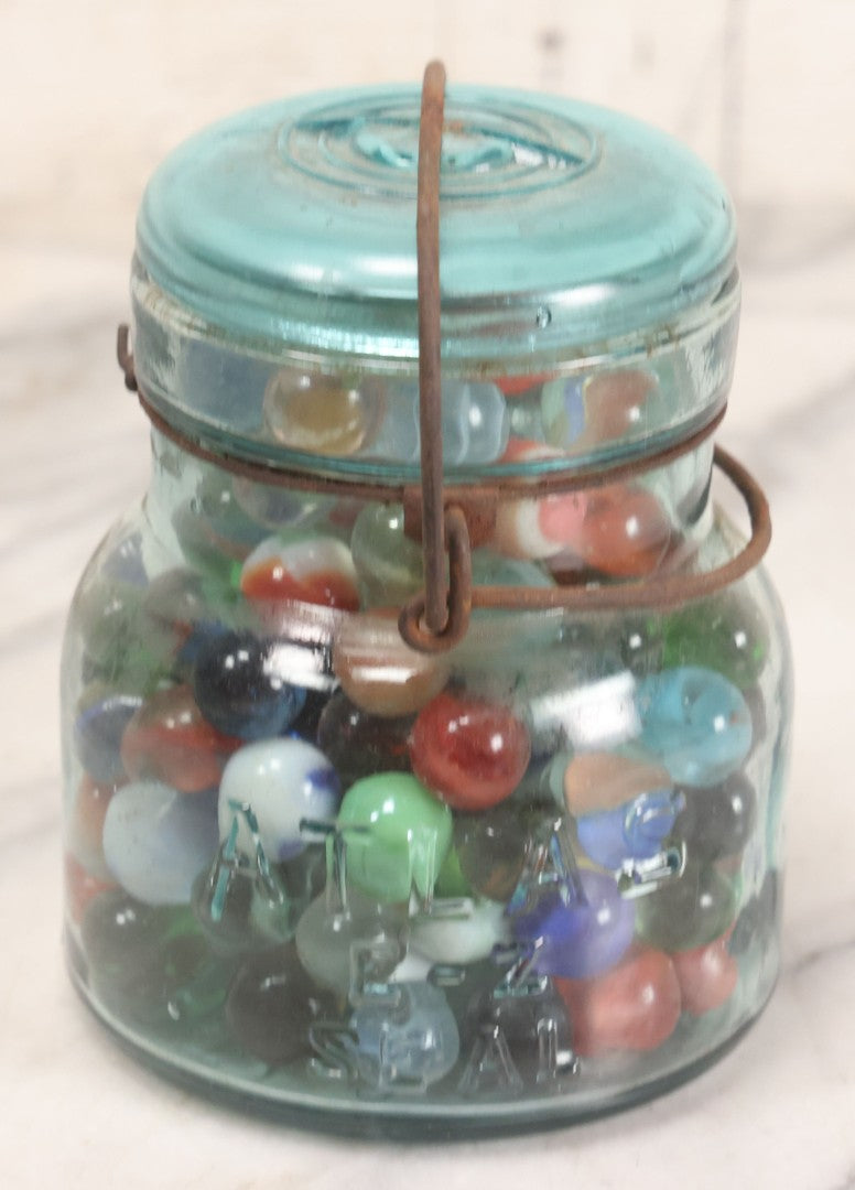 Lot 211 - Vintage Mason Jar Full Of Marbles With Wire Bail Closure