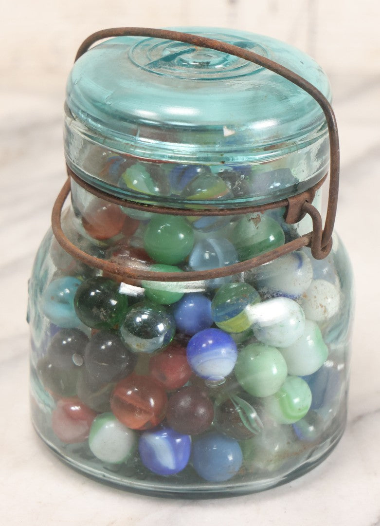 Lot 211 - Vintage Mason Jar Full Of Marbles With Wire Bail Closure