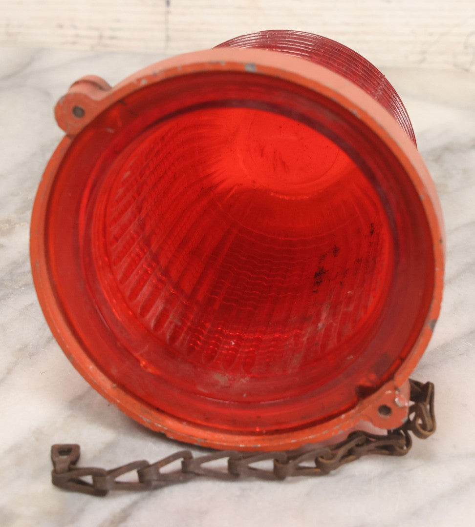 Lot 212 - Vintage Red Glass Warning Light Lens With Orange Painted Metal Base And Chain, 5-1/4" H