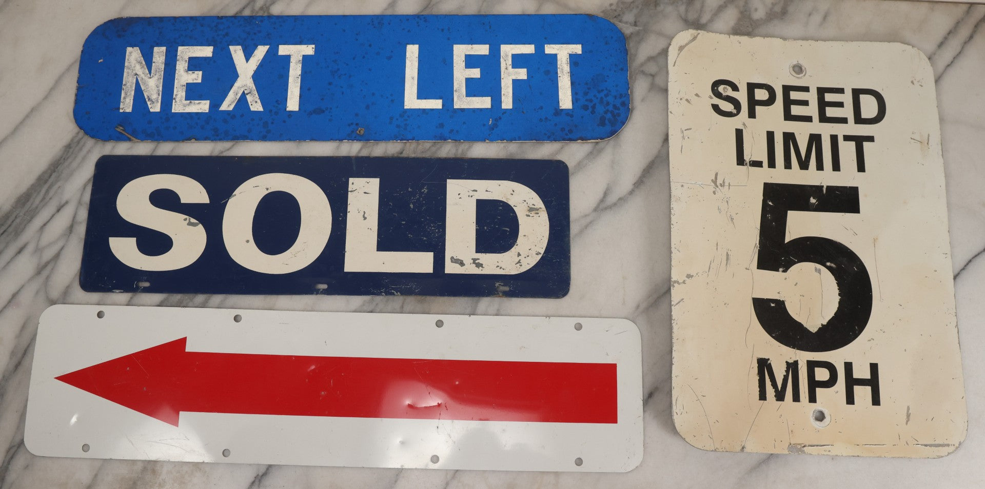 Lot 214 - Grouping Of Four Modern Outdoor Metal Signs: "Next Left" With "Ironman" Letters In Black Marker On Verso, Speed Limit 5 Mph, And Double-Sided Red Arrow And Sold Signs