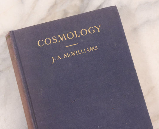 Lot 231 - "Cosmology: A Text For Colleges" Vintage Cosmology Textbook By J. A. McWilliams, Published By The Macmillan Company, New York, 1938