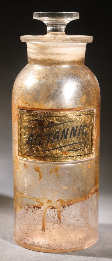 Lot 017 - Antique Apothecary Glass Jar, "Ac. Tannic" (Tannic Acid), Reverse-Painted Gold Glass Label, Glass Stopper, Manufactured By Whitall Tatum Company, U.S.A..