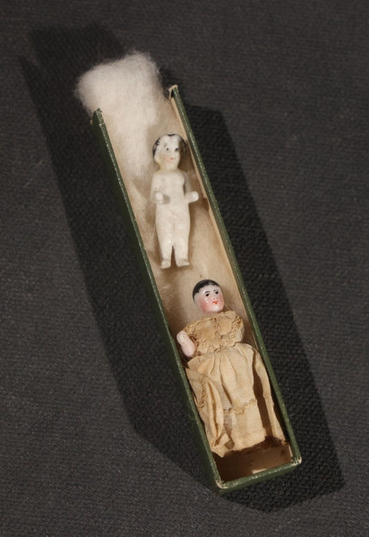 Lot 045 - Pair Of Antique Miniature Frozen Charlotte Dolls, One Porcelain In Cloth Gown And One Bisque