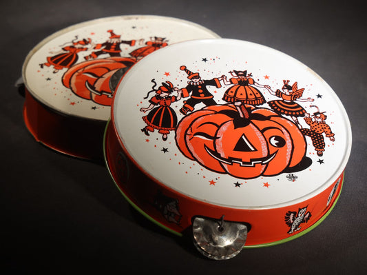 Lot 048 - Pair Of Vintage Halloween Tin Lithograph Toy Tambourine Noisemakers With Jack-O-Lantern J.O.L. And Costume Parade Graphics, U.S. Metal Toy Mfg. Co., Made In U.S.A..