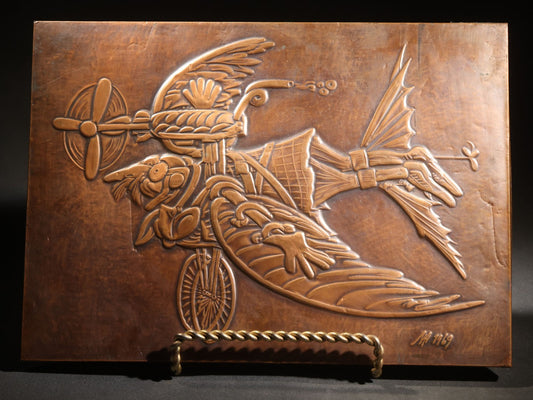 Lot 051 - Vintage Copper Repoussé Plaque On Plywood, Fantastical Winged Figure On Unicycle With Propeller, Signed And Dated 1969, Gifted From Reck, Germany, 1972, 9-1/4" x 13"