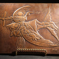 Lot 051 - Vintage Copper Repoussé Plaque On Plywood, Fantastical Winged Figure On Unicycle With Propeller, Signed And Dated 1969, Gifted From Reck, Germany, 1972, 9-1/4" x 13"