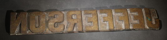 Lot 057 - Antique Bronze Printing Plate, "Jefferson" In Relief Block Letters, Milled Surface, Bowed, 16-1/4" L