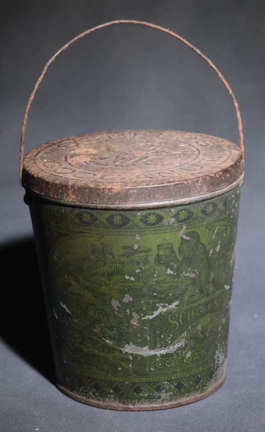 Lot 086 - Antique Schepp's Cocoanut Lithographed Tin Pail With Embossed Lid, Tropical Scene With Monkey, Palm Trees, And Sailing Ship, Note Graphic Loss