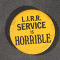 Lot 105 - Vintage "L.I.R.R. Service Is Horrible" Long Island Rail Road Protest Pinback Button, Yellow And Black