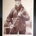 Lot 134 - Antique Cabinet Card Photograph Of A Rugged New England Man In Heavy Coat, Cap, Gloves, And Scarf Holding A Walking Stick, Ink-Inscribed "Joel Simons," Photographed By Bullock, Northfield, Vermont