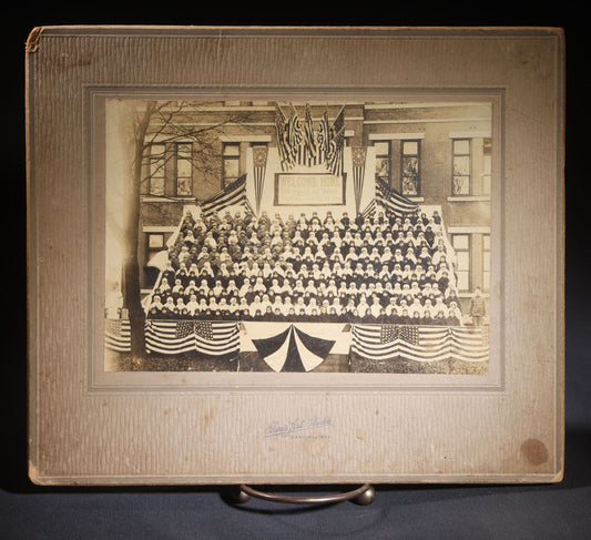 Lot 138 - Antique Board-Mounted Photograph Of Children Posed On Steps Of A Brick Building With WWI "Welcome Home" Banner, American Flags, And Patriotic Bunting, Photographed By Shea's Art Studio, Danbury, Connecticut