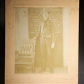 Lot 143 - Antique Board-Mounted Photograph Of A Man In Western Dress With Cowboy Hat, Decorative Shirt, And Fraternal Ribbon Badge With Eagle Device, "Bbv" Belt Buckle