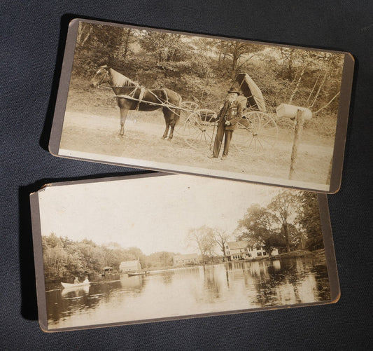 Lot 147 - Pair Of Antique Board-Mounted Panoramic Photographs, New England Pond With Rowboat And Houses, And Bearded Man With Horse And Buggy At Mailbox