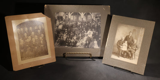 Lot 151 - Trio Of Antique Board-Mounted Group Photographs Including Large Gathering With American And British Flags At Arched Pavilion, Elderly Men In Formal Dress, And Generational Family Studio Portrait