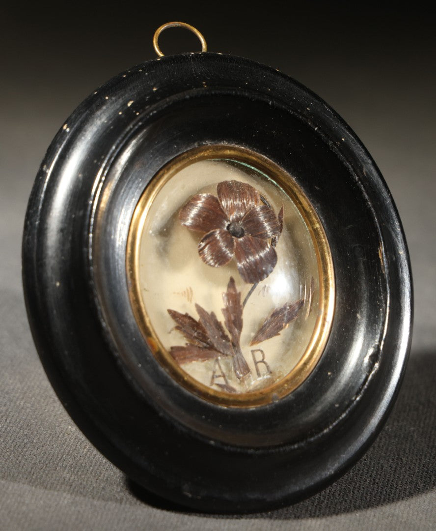 Antique French Hair Work Keepsake Palette Under Convex Glass, Floral Motif with Initials "A R," Inscribed "Annee 1885" ("Year 1885") on Reverse