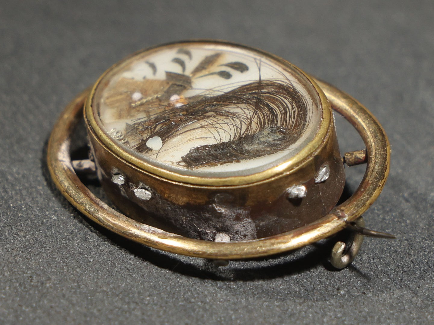 Antique Victorian Hair Work Keepsake Brooch with Floral Palette Under Convex Glass in Gold-Tone Oval Setting