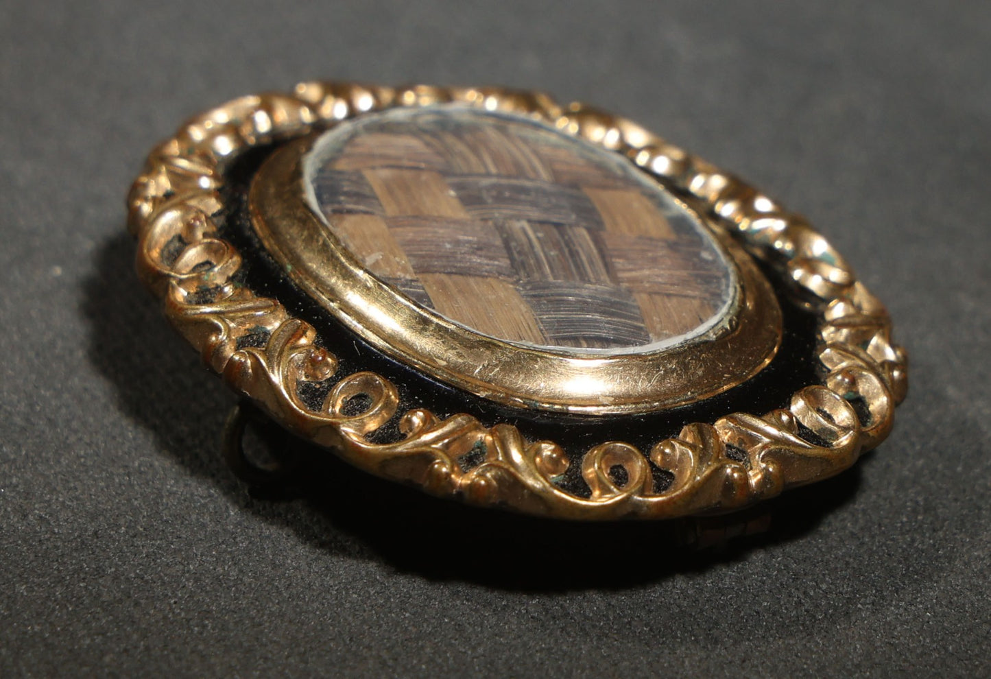 Antique Victorian Hair Work Keepsake Brooch with Woven Hair Under Glass, Black Enamel Border with Gold-Tone Scroll Frame and Pendant Loop