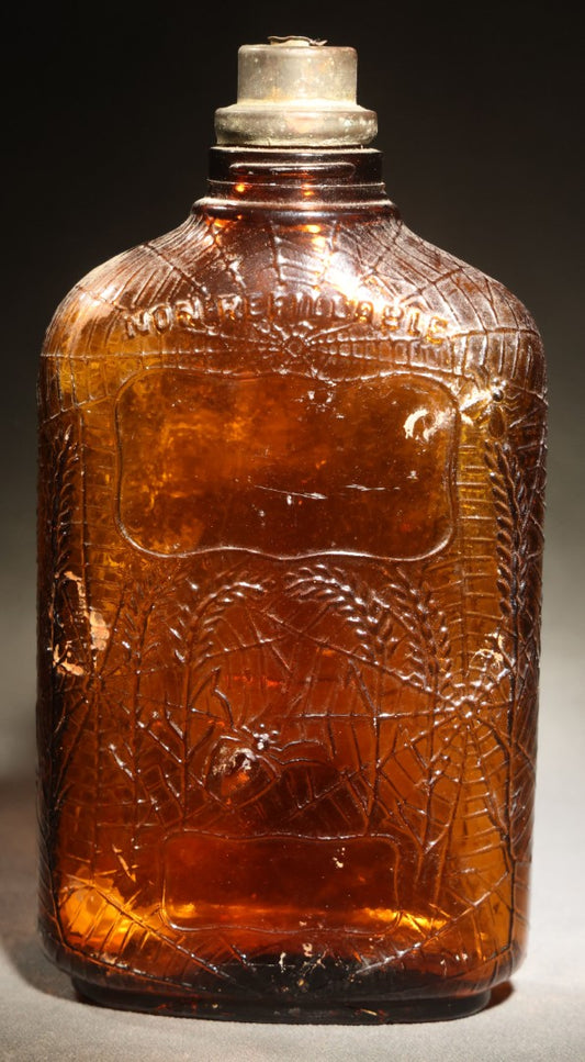 Vintage Embossed Amber Glass Whiskey Bottle with Spider Web, Spider, and Wheat Motifs, Marked "Non Refillable" and "Pat. Pending"