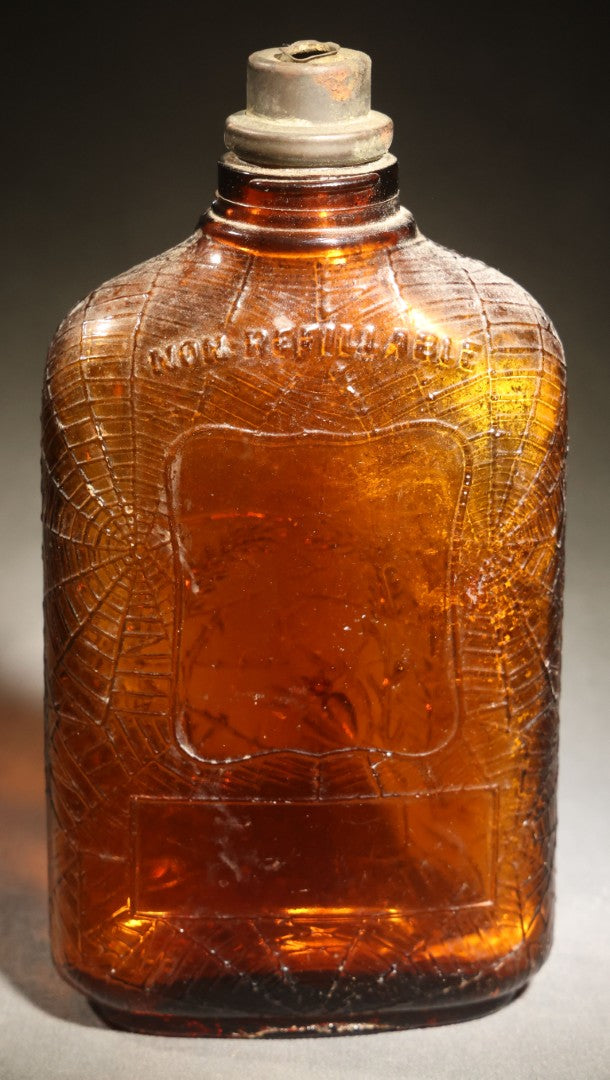 Vintage Embossed Amber Glass Whiskey Bottle with Spider Web, Spider, and Wheat Motifs, Marked "Non Refillable" and "Pat. Pending"