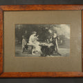 Lot 071 - Antique Framed Print After "Her First Love Letter" by Marcus Stone (English, 1840-1921), Two Young Women Seated at a Garden Table with a Cat, 15-1/2" W x 12-1/2" H