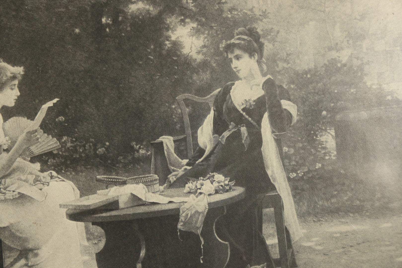 Antique Framed Print After "Her First Love Letter" by Marcus Stone (English, 1840-1921), Two Young Women Seated at a Garden Table with a Cat